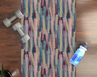 May include: A yoga mat with a colorful abstract pattern featuring gold glitter accents. The pattern includes shades of pink, blue, and purple.