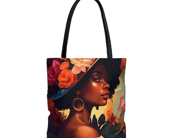 May include: A tote bag featuring a colorful illustration of a woman with dark brown skin wearing a large floral hat. The woman has dark brown hair and is looking to the right. The background is a mix of green, yellow, and orange.
