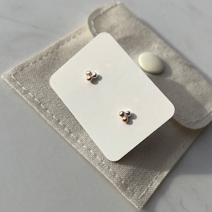 Mixed metal three bubble studs