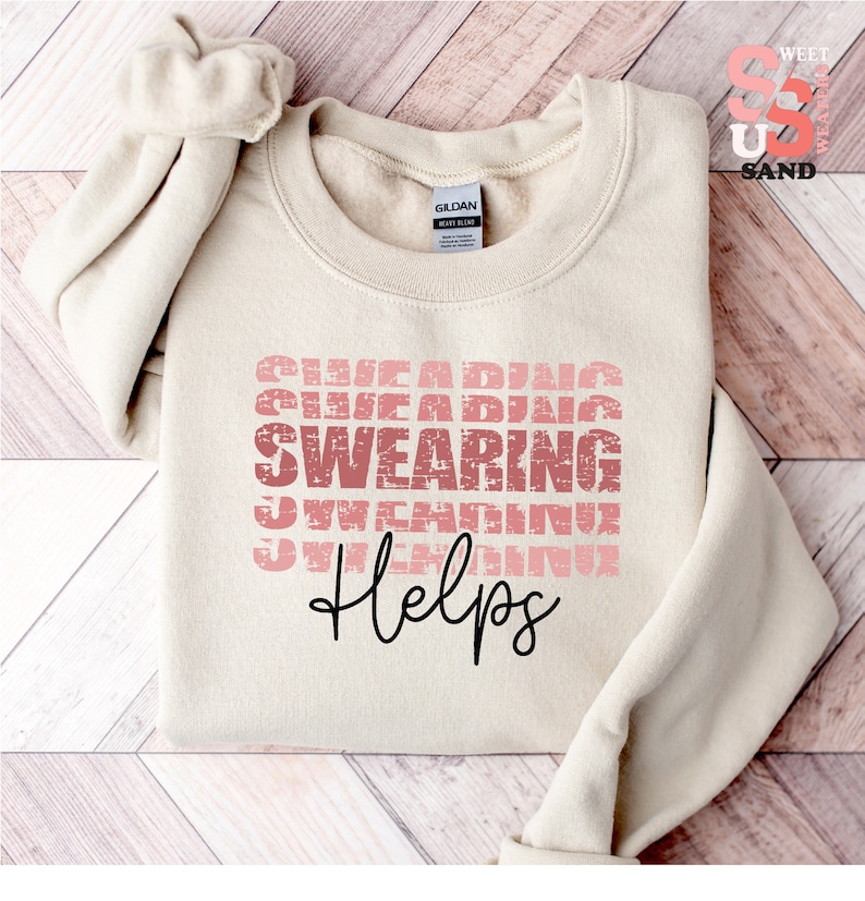 a sweater with a message on it on a wooden floor