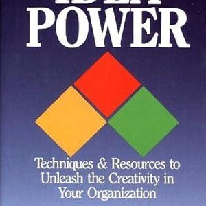 May include: Book cover with the title "IDEA POWER" in white text. The cover features a blue background with a three-color diamond shape in the center. The diamond is made up of red, yellow, and green squares. The text below the title reads "Techniques & Resources to Unleash the Creativity in Your Organization" and "Arthur B. VanGundy".