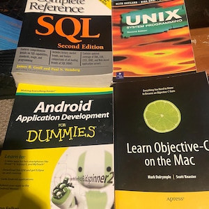 May include: A collection of four technical books including The Complete Reference SQL Second Edition, UNIX System Programming Second Edition, Android Application Development For Dummies, and Learn Objective-C on the Mac with various graphic covers.