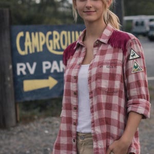 This is an AI image showing what the flannel shirt could look like paired with a cute skirt. (Some details of the flannel shirt may not match exactly as the actual flannel shirt. This picture is for reference only).
