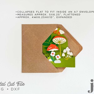 May include: A digital cut file for a pop-up card featuring a mushroom and butterfly design. The card is shown folded inside a brown envelope. The text on the image reads "COLLAPSES FLAT TO FIT INSIDE AN A7 ENVELOPE, MEASURES APPROX. 5X6.25", FLATTENED, APPROX. 4WX6.25HX1D, EXPANDED, Digital Cut File, SVG, DXF, je".