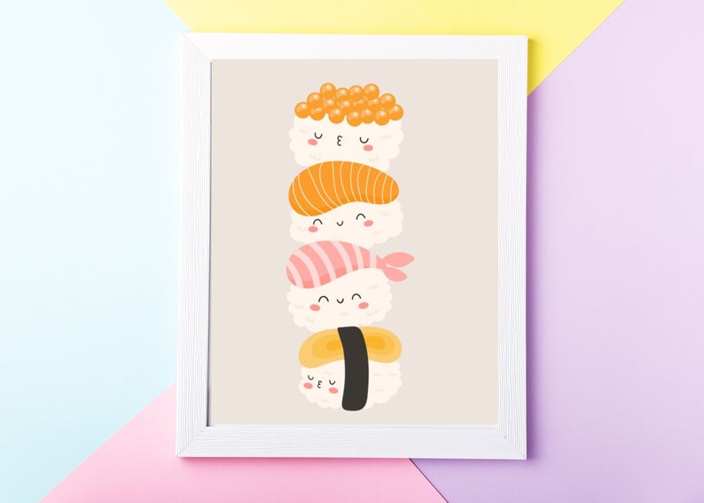 May include: A white framed print with a stack of four cartoon sushi rolls with smiling faces. The sushi rolls are stacked from top to bottom: a roll with orange fish eggs, a roll with orange fish, a roll with pink fish, and a roll with a yellow egg.