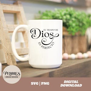 May include: White ceramic coffee mug with a black design that reads "El Tiempo de Dios es Perfecto".