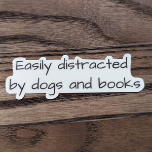 Easily distracted by books and dogs sticker