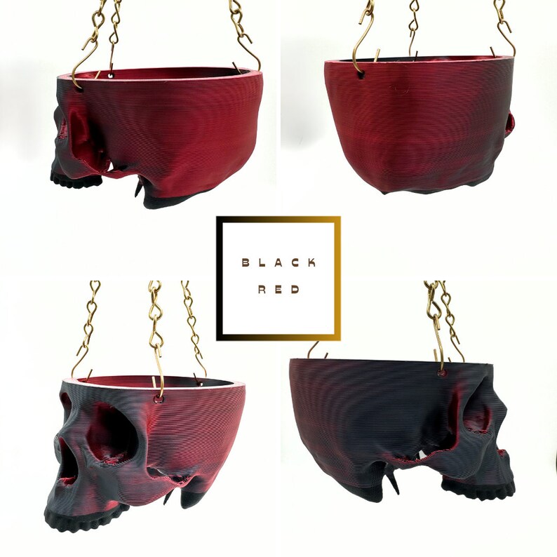 May include: Four hanging skull planters, two are black and two are red. The planters are made of a 3D printed material and have a textured surface. The planters are hanging from gold chains.