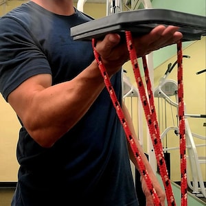 Weight lifting attachment for muscle building and fitness.