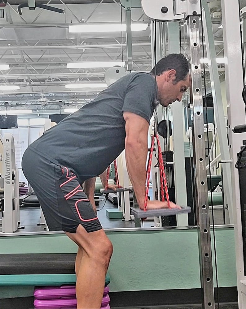 Isoboard press downs  are a surprising challenge for the triceps and chest.
