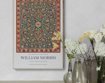 May include: A framed print featuring a detailed floral pattern in shades of teal, red, and gold. The print includes the text "WILLIAM MORRIS" and "COTTON PRINTS EXHIBITION". The artwork is displayed in a gold frame.