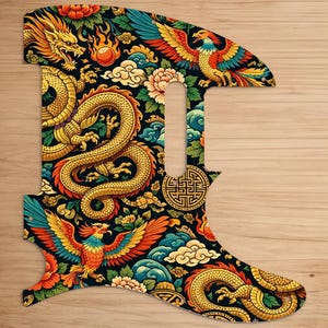 May include: A guitar pickguard with a vibrant Asian-inspired design. The pickguard features a black background adorned with a golden dragon, phoenixes, flowers, and clouds. The design is intricate and colorful, with red, orange, blue, and green accents.