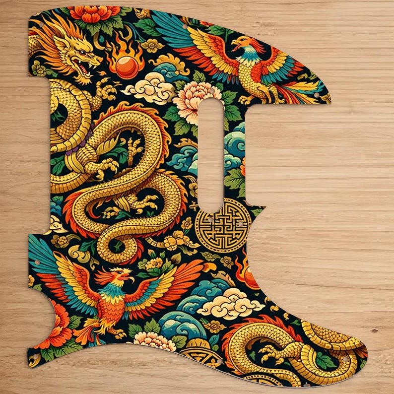 May include: A guitar pickguard with a vibrant Asian-inspired design. The pickguard features a black background adorned with a golden dragon, phoenixes, flowers, and clouds. The design is intricate and colorful, with red, orange, blue, and green accents.