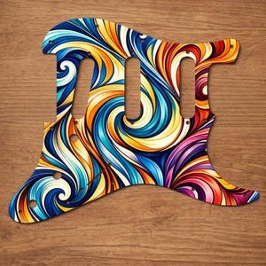 Puede incluir: Un colorido golpeador de guitarra con un dise&ntilde;o abstracto y ondulado en tonos de azul, amarillo, naranja, rojo y morado. El golpeador tiene tres recortes para pastillas y varios agujeros para tornillos. Fondo de madera.