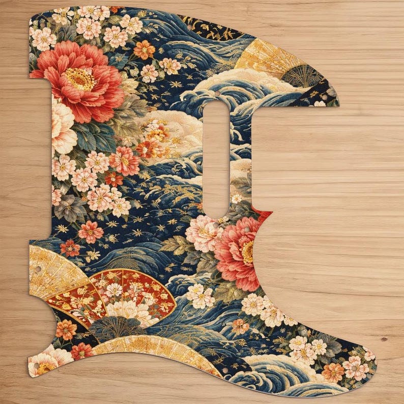 May include: A guitar pickguard with a Japanese-inspired floral design. The pickguard features a dark blue background with red, pink, and white flowers, gold accents, and stylized waves and fans.