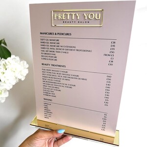 May include: A beauty salon menu with the text "PRETTY YOU BEAUTY SALON" in gold lettering. The menu lists various manicure, pedicure, and beauty treatment services, including prices in British pounds.