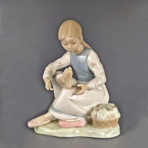 NAO by Lladro Porcelain Figurine, Girl Putting on Shoe, Made in Spain, Handcrafted, Rare Collectible, Discontinued, 1970s, Mint Condition
