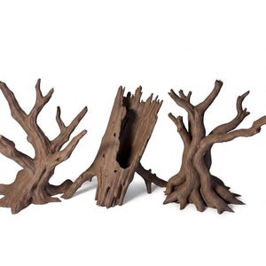 May include: Three brown, textured tree-themed decorative pieces. Two pieces are shaped like bare, gnarled trees with spreading branches and wide bases. The central piece is a hollow, upright log with a jagged, open top and a textured bark surface.