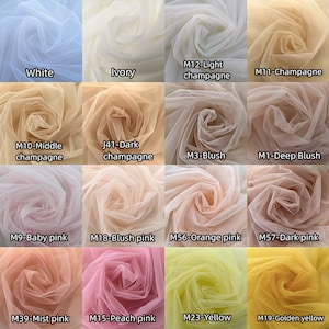 May include: A swatch card showing 12 different colors of tulle fabric. The colors are: white, ivory, light champagne, champagne, middle champagne, dark champagne, blush, deep blush, baby pink, blush pink, orange pink, dark pink, mist pink, peach pink, yellow, and golden yellow.