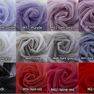 May include: A collection of 12 tulle fabric swatches in various colors, including lavender purple, dark purple, grape purple, middle gray, gray, dark gray, dark dusty blue, black, dark red, wine red, and red. The swatches are arranged in a grid pattern.