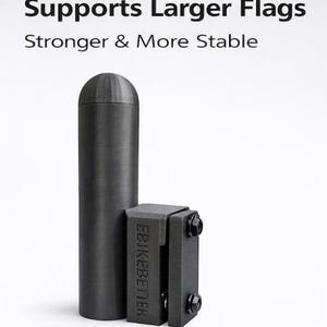 May include: A black flag pole and bracket set. The pole is cylindrical with a rounded top. The bracket is rectangular with two hinged sections and visible bolts. Text on the image reads "Supports Larger Flags" and "Stronger & More Stable."
