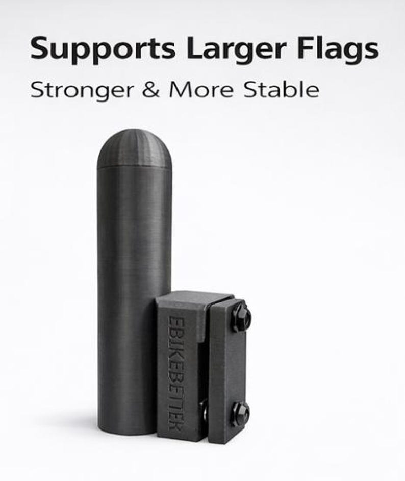 May include: A black flag pole and bracket set. The pole is cylindrical with a rounded top. The bracket is rectangular with two hinged sections and visible bolts. Text on the image reads "Supports Larger Flags" and "Stronger & More Stable."