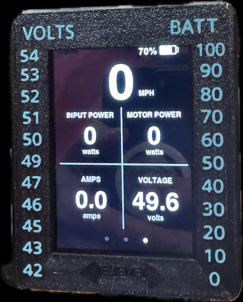 May include: Digital display showing readings for volts, amps, and battery percentage. The screen displays "0" for MPH, input power, and motor power. The voltage reads 49.6 volts, and the amps read 0.0 amps.