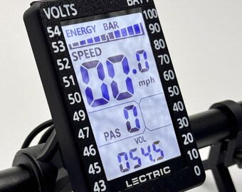 Może przedstawiać: Czarny wyświetlacz do roweru elektrycznego z cyfrowym ekranem pokazującym prędkość 0,0 mph i poziom naładowania baterii 54,5. Wyświetlacz pokazuje również pasek energii, poziom PAS i poziom VOL.