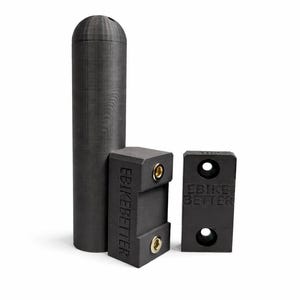 May include: Three black e-bike accessories are displayed against a white background. The items include a tall, cylindrical piece and two rectangular pieces with the text "EBIKE BETTER". The rectangular pieces have holes.