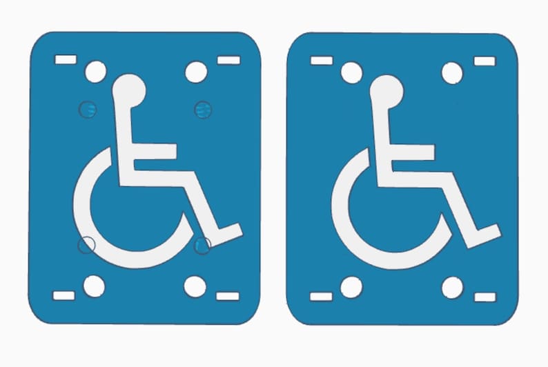 May include: Two blue rectangular signs with a white wheelchair symbol. Each sign has a rounded top and bottom, with white circles and dashes at the top and bottom. The wheelchair symbol is a stylized figure in a wheelchair.