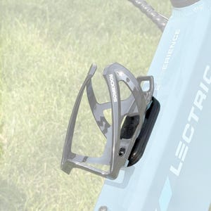 May include: A gray ROCKBROS water bottle cage mounted on a light blue bicycle frame. The cage is made of a lightweight material and has a black, padded section. The bicycle frame has the word "LECTRIC" printed on it.