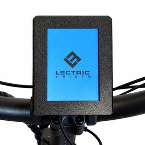 May include: A black rectangular display screen with the text "LECTRIC e BIKES" on a blue background. The screen is mounted on a black handlebar, likely for an electric bicycle.