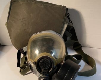 Vintage military gas mask with case