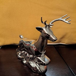 Silver Avon perfume bottle