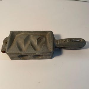 May include: A set of three ceramic mugs with a speckled, matte finish. The mugs are in shades of cream, light gray, and dark gray. Each mug has a simple, minimalist design, perfect for coffee or tea.