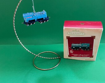 Ornement de train de Noël comète Lionel bleu. Huile essentielle