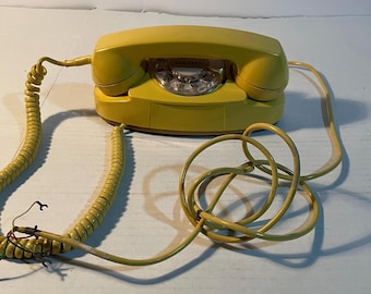 Vintage yellow rotary princess phone