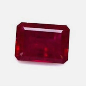 May include: A deep red gemstone with a rectangular emerald cut.