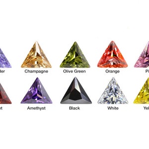May include: Ten triangular shaped gemstones in various colors, including lavender, champagne, olive green, orange, pink, garnet, amethyst, black, white, and yellow.
