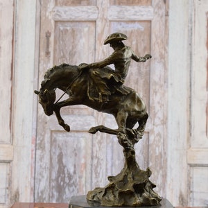 Bronze Rodeo Rider Statue: Cowboy on Bucking Horse Figurine