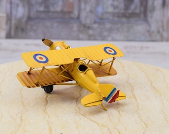 Vintage Yellow Metal Airplane Model: Classic Biplane Decor