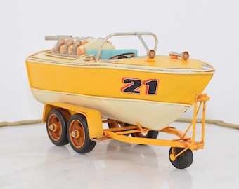 Vintage Metal Motorboat on Trailer: Retro Nautical Decor