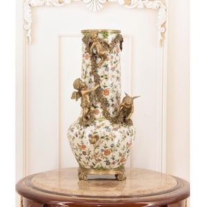 Vintage Porcelain Cherub Vase: Bronze Ornaments, Floral Design