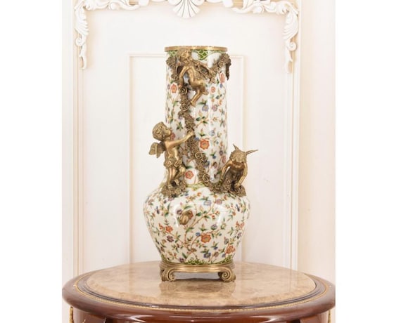 Vintage Porcelain Cherub Vase: Bronze Ornaments, Floral Design