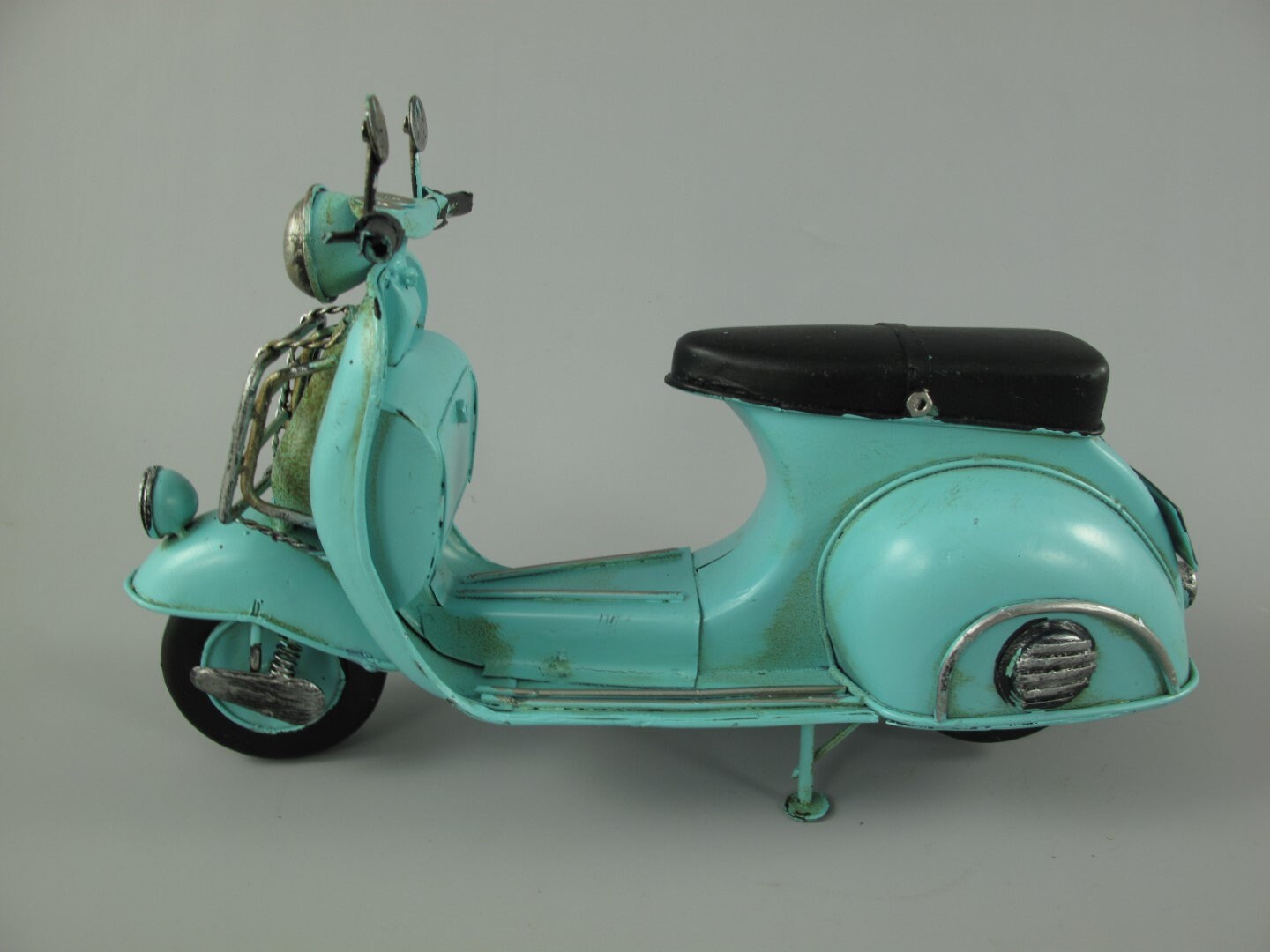 miniature toy vespa, black and blue with shiny metal