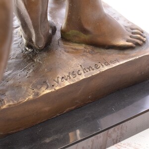 May include: Bronze sculpture of two figures standing on a rectangular base. The base is inscribed with the artist's signature, "J. Varschneider".