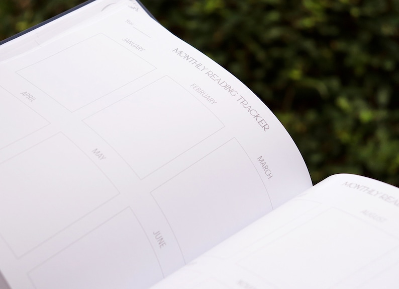 May include: A white monthly reading tracker with a grid of six squares. Each square is labeled with a month of the year: January, February, March, April, May, and June.