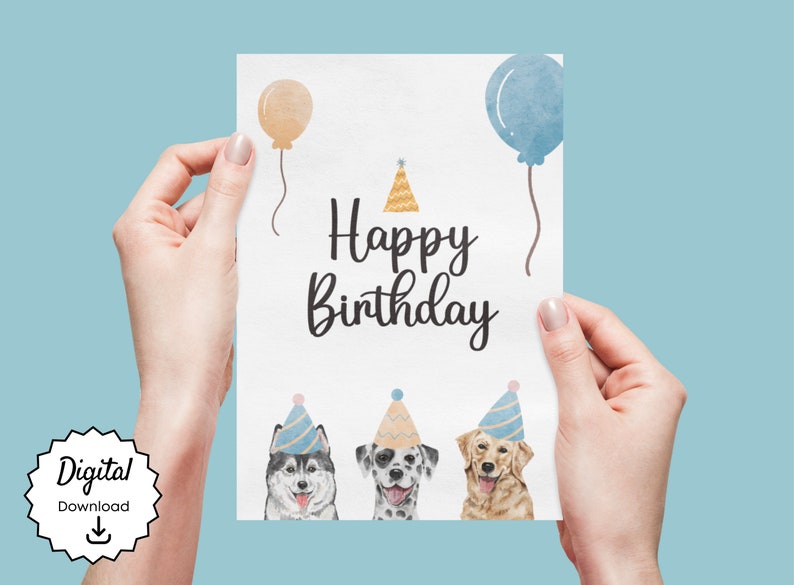 K&ouml;nnte beinhalten: Eine wei&szlig;e Karte mit dem Text "Happy Birthday" in schwarzer Schrift. Am unteren Rand der Karte befinden sich drei Hunde mit Partyh&uuml;ten. Die Hunde sind ein Husky, ein Dalmatiner und ein Golden Retriever. Oben auf der Karte befinden sich zwei Ballons, einer in Pfirsich und einer in Blau.