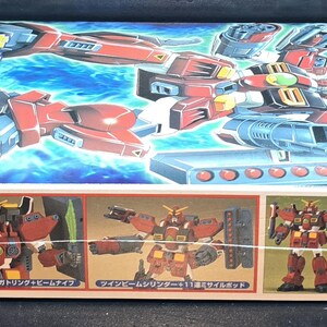 May include: A rectangular model kit box for the Gundam Leopard Destroy mobile suit. The box features a vibrant illustration of the red, white, and blue robot against a blue background, with smaller images showing the assembled figure and accessories.