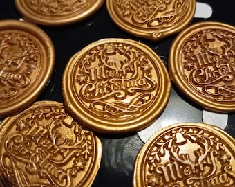 May include: Gold-colored wax seals with the words "Merry Christmas" embossed in an elegant script. The seals feature decorative elements like bells and foliage, perfect for holiday crafts and adding a festive touch to gifts and cards.